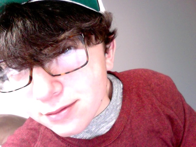 me in a red sweater and a hat and glasses.jpg