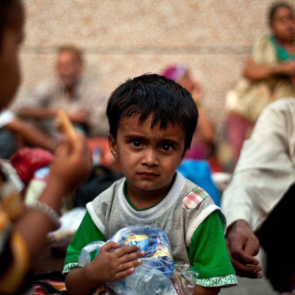 An-Indian-boy-rescued-from-flood-hit-areas-waits-with-others-before-being-sent-to-relief-camps-in-Dehradun-state-capital-of-Uttarakhand-on-June-21-2013-.jpeg