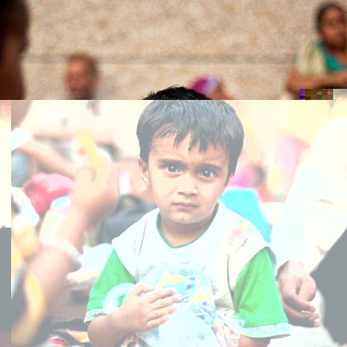 An-Indian-boy-rescued-from-flood-hit-areas-waits-with-others-before-being-sent-to-relief-camps-in-Dehradun-state-capital-of-Uttarakhand-on-June-21-2013-.jpeg
